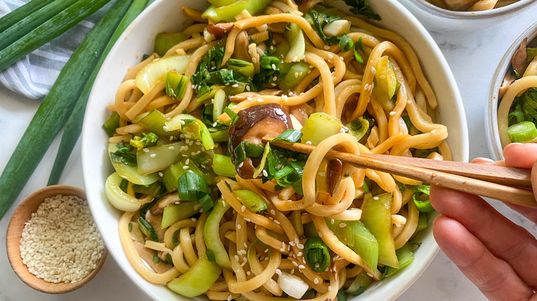 stir-fried udon noodles in bowl