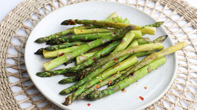 cooked asparagus spears on plate