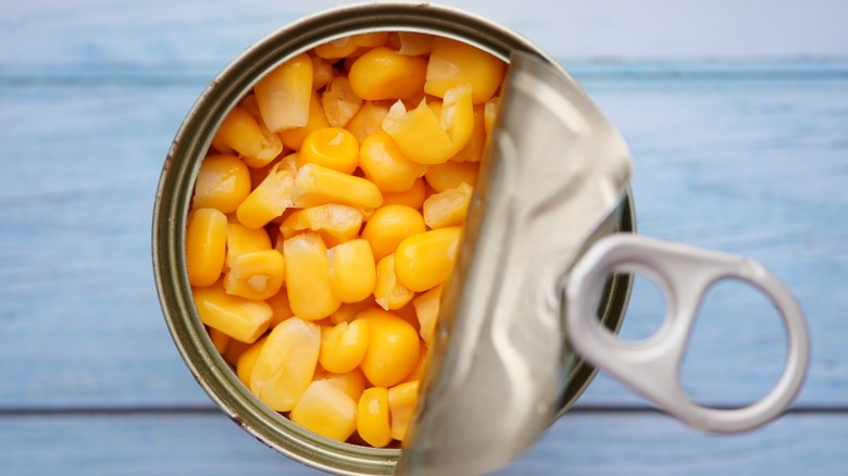 canned corn with lid pulled back