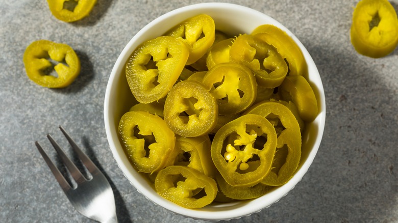 dish of canned jalapeno peppers
