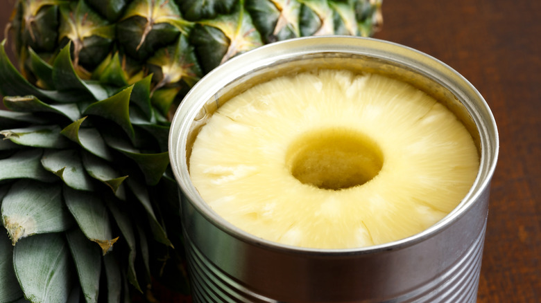 canned pineapple next to whole pineapple