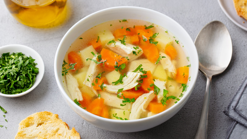 Chicken noodle soup in white bowl