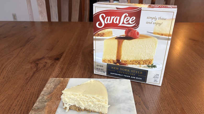 slice of cheesecake on plate with cheesecake box