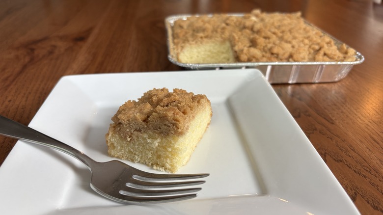 Square slice of coffee cake with fork on plate