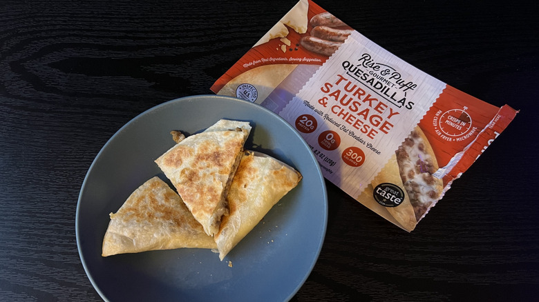 Sliced turkey sausage & cheese quesadilla in blue bowl with packaging