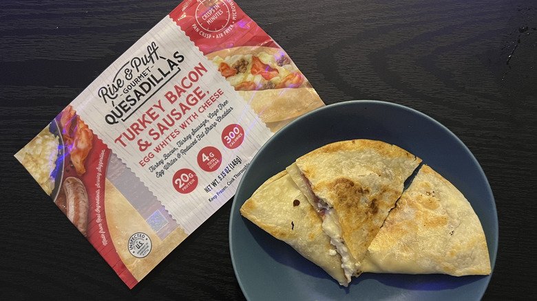 Sliced turkey bacon & sausage quesadilla in blue bowl with packaging