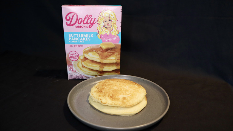 pancake on plate in front of Dolly Parton box