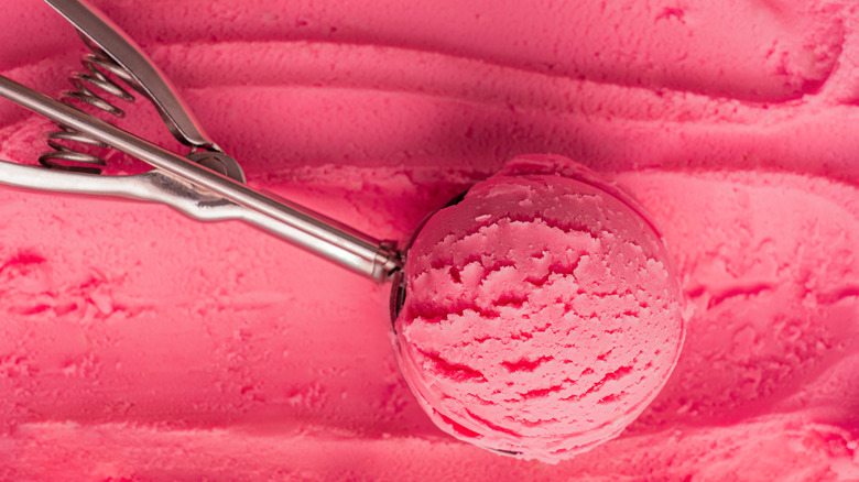 Top view of strawberry sherbet with scoop