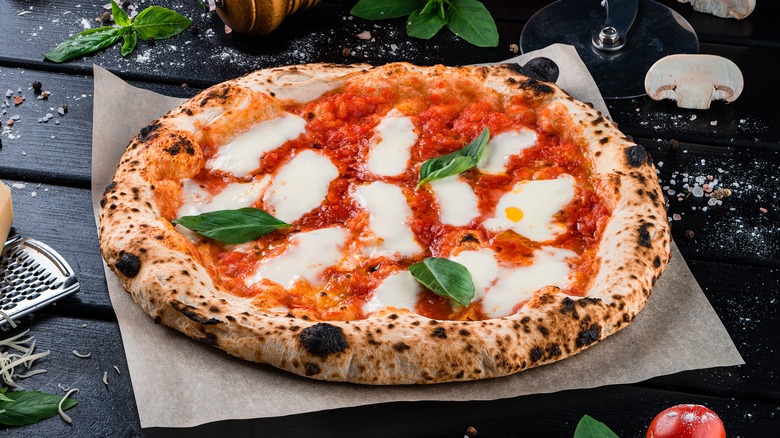 Neapolitan pizza on wooden table