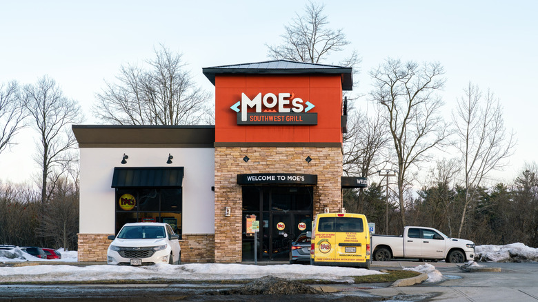 A sign says "Welcome to Moe's" over the entrance to Moe's Southwest Grill