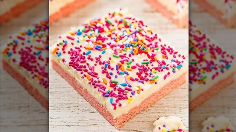 Strawberry cake slice with sprinkles