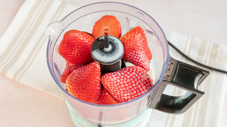 pureeing strawberries in food processor