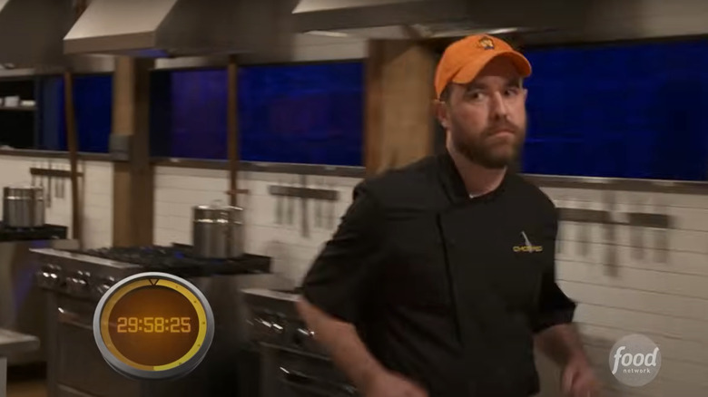 contestant running between station and pantry