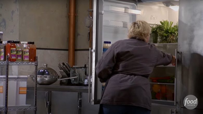 contestant reaching into "Chopped" communal fridge