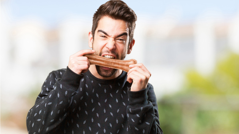 Man chewing bone
