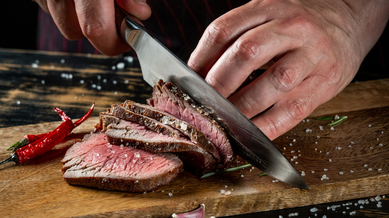 Slicing steak at a steakhouse