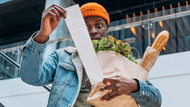 A man is shocked by his grocery bill