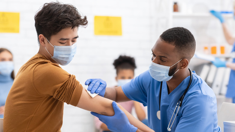 Person has arm prepped for vaccination