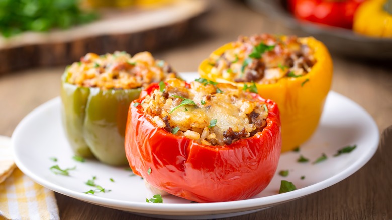 Three stuffed peppers on plate 