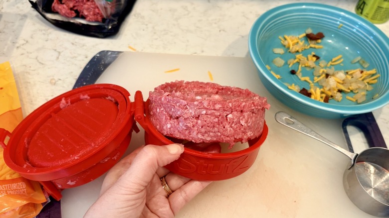 A stuffed burger coming out of the Stufz burger press, As Seen On TV