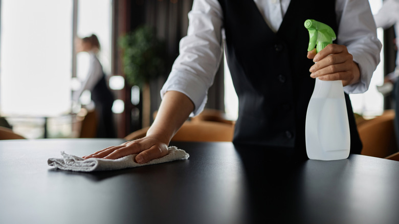 Restaurant servers cleaning tables