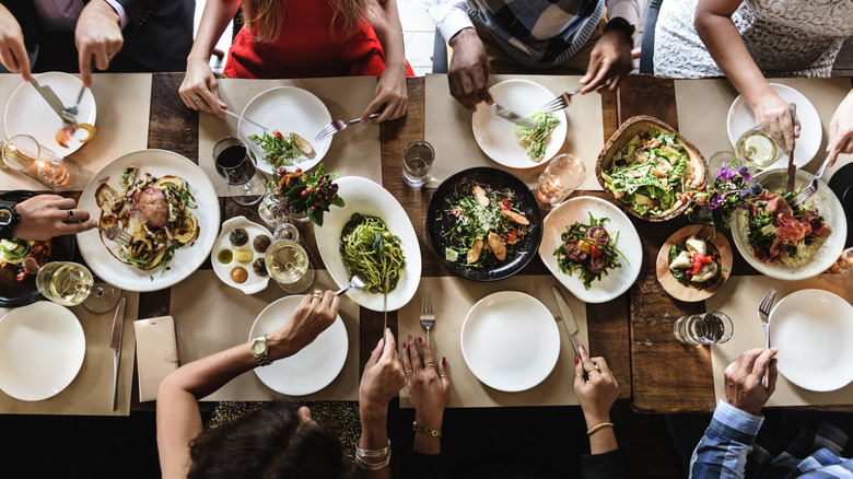 Overhead view of people eating at restaurant table