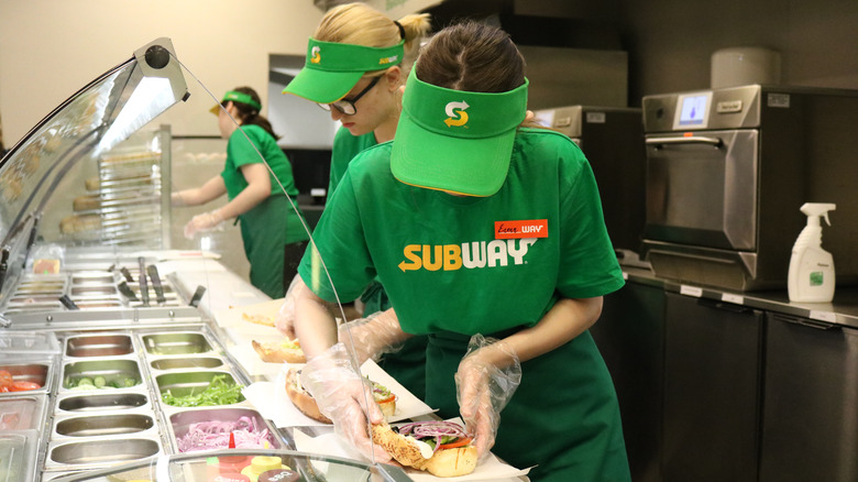 Subway workers making sandwiches