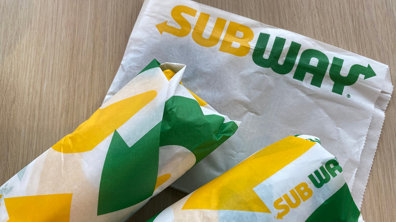 Two Wrapped Subway Sandwiches