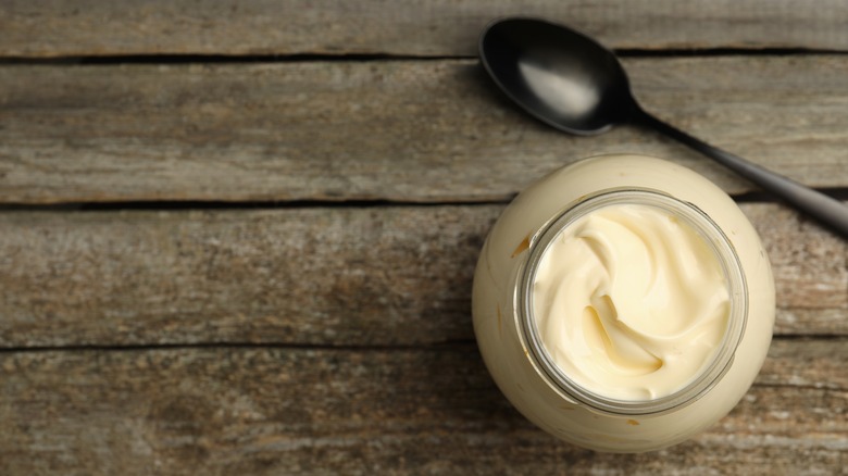 Jar of mayonnaise with spoon