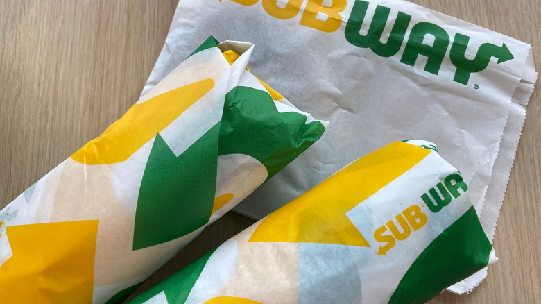 Subway sandwiches on a brown table