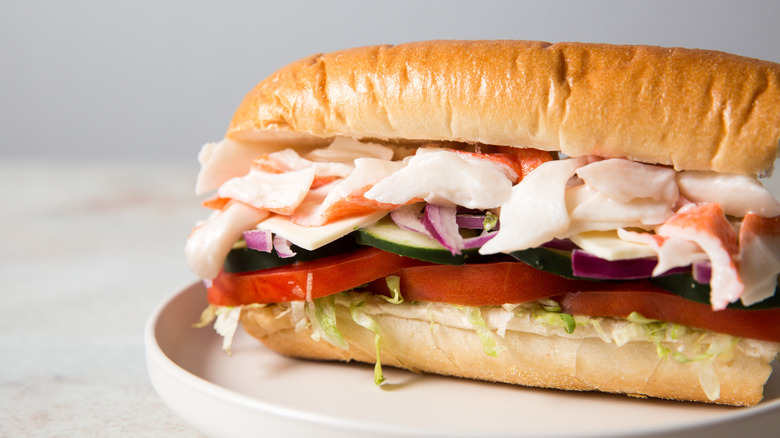 Close up of seafood sub on plate