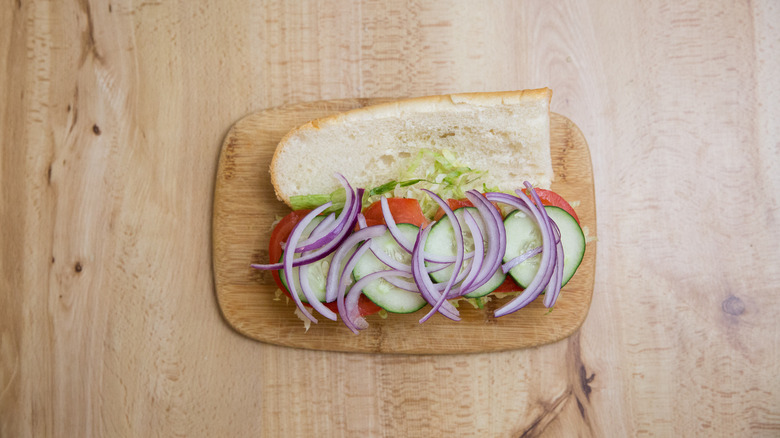 vegetables layered on open roll
