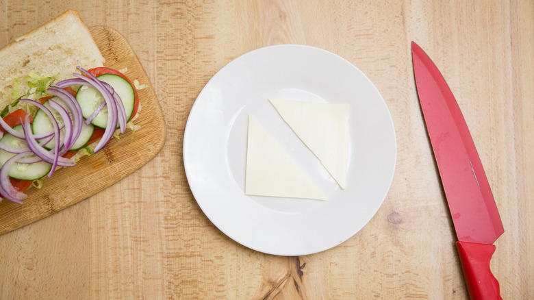 cheese hoagie on cutting board