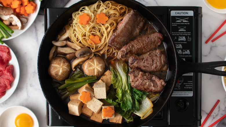 cooked sukiyaki with ingrdients