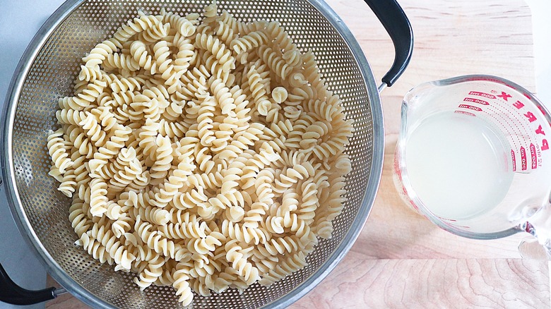 draining pasta for the salad