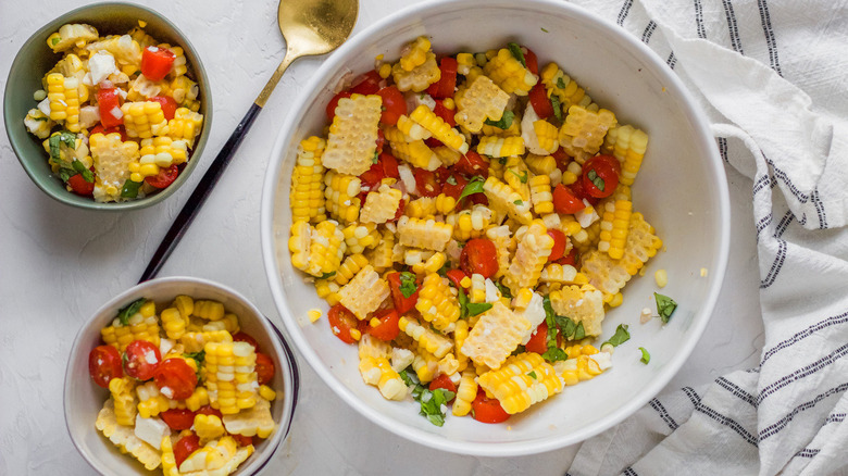 salad in serving bowl and smaller bowls