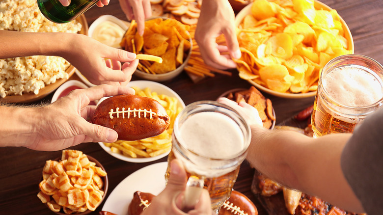 people enjoying football food spread