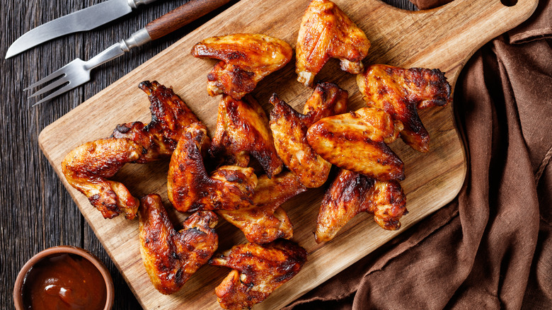 chicken wings on wooden board