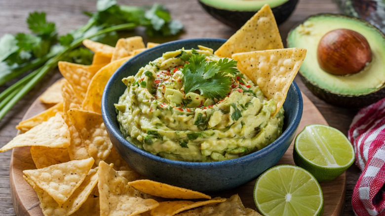 bowl of guacamole with tortilla chips