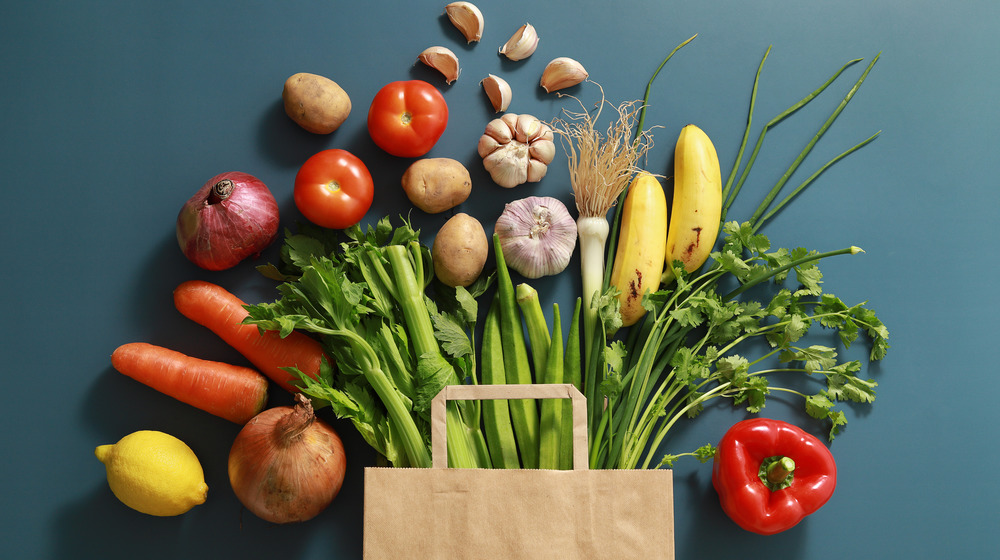 Bag with vegetables spilling out