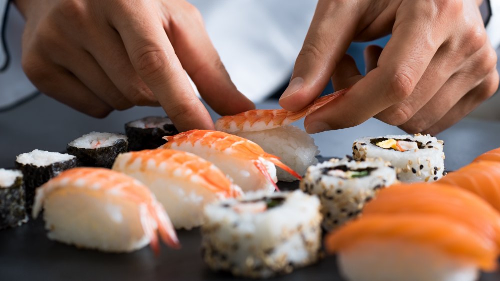 Sushi chef making sushi