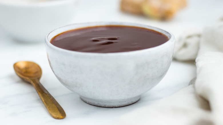 sweet and sour sauce in white bowl