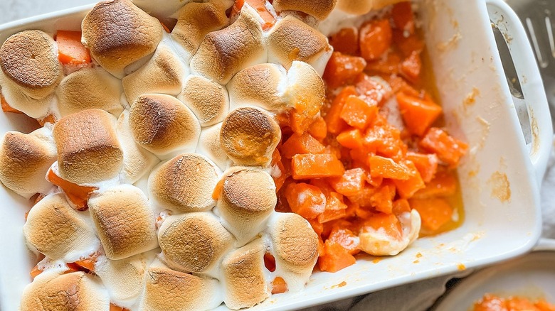 Candied yams in a white dish
