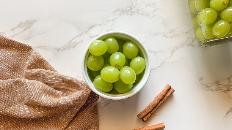 Pickled grapes with cinnamon stick