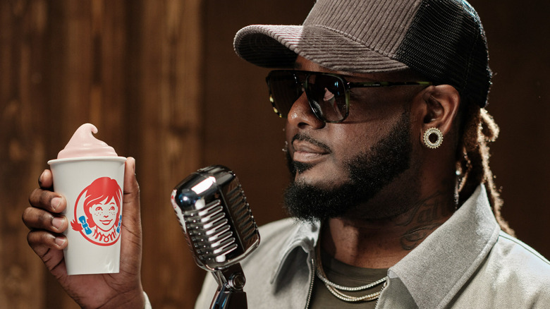 T-Pain holding a strawberry Frosty