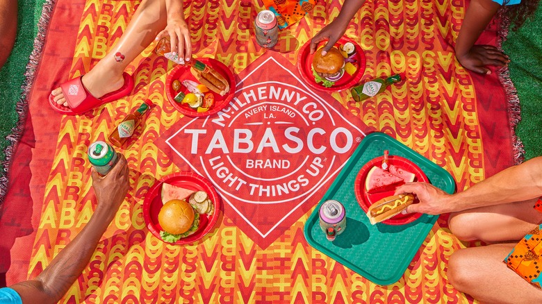 People eating on Tabasco picnic blanket