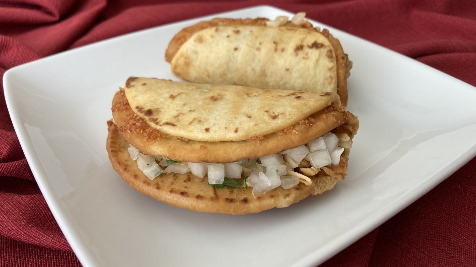 Taco Bell Cheesy Street Chalupa Review: A Small Bite That Delivers A Spicy Kick To The Taste Buds