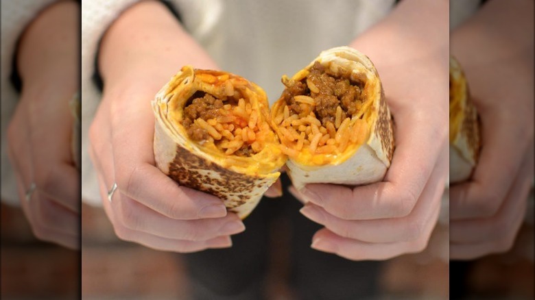 Person holding a Taco Bell Quesarito 