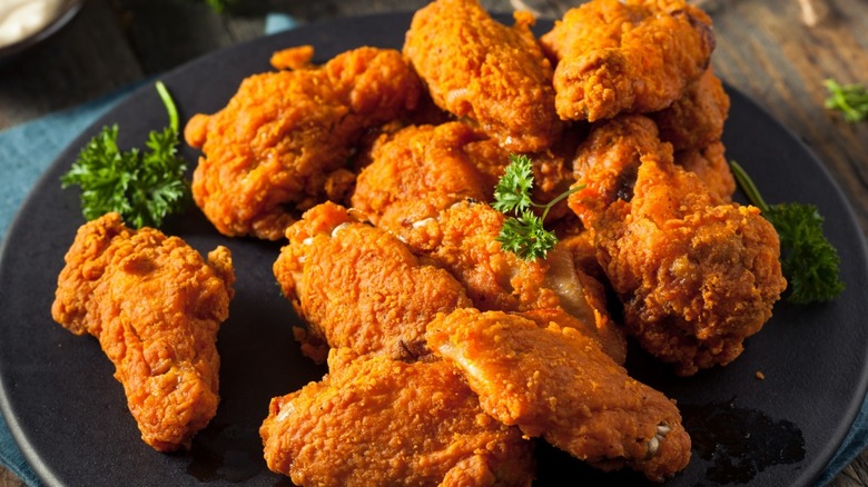 Buffalo-style chicken wings on plate