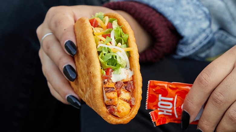 hand holding Bacon Club Chalupa